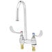 A T&S chrome deck mounted lavatory faucet with two wrist handles.