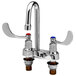 A chrome T&S medical faucet with 2 wrist handles and a swivel gooseneck spout.