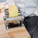 A chef using the Weston Roma Manual Pasta Machine to make pasta.