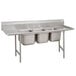 A stainless steel Advance Tabco Regaline three compartment sink with two drainboards.