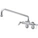 A T&S chrome wall mount faucet with lever handles and a swing spout.