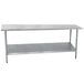 An Advance Tabco stainless steel work table with a galvanized undershelf.