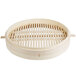 A Town bamboo steamer with wooden handles.