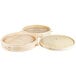 A Town bamboo steamer set with three round wooden trays and lids.