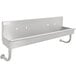 A stainless steel Advance Tabco multi-station hand sink with 5 holes.