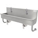 A stainless steel Advance Tabco hand sink with knee-operated faucets.