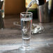 A Libbey cordial glass being filled with liquid.