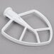 A white KitchenAid coated flat beater with a handle.