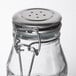 A Tablecraft glass jar with a stainless steel clip-top lid.