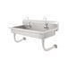 A stainless steel Advance Tabco hand sink with 6 faucets.