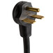A close-up of a black and gold Cooking Performance Group power plug.
