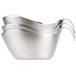 A close-up of several stainless steel Tablecraft gravy boats.