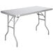 A Regency stainless steel rectangular folding work table with an open metal base.
