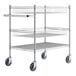 A Regency chrome utility cart with two baskets and one shelf on wheels.