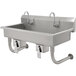 A stainless steel Advance Tabco multi-station hand sink with knee operated faucets.