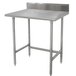 An Advance Tabco stainless steel work table with backsplash on a counter.