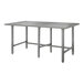 An Advance Tabco stainless steel work table with a rectangular top and galvanized legs.