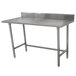 An Advance Tabco stainless steel work table with a stainless steel top.
