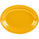A yellow oval Fiesta china platter on a white background.
