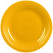 A yellow Fiesta dinner plate with a ring on the rim.