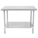 An Advance Tabco stainless steel work table with undershelf.