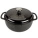 A black Lodge enameled cast iron dutch oven with a lid.