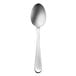 A Oneida Flight stainless steel dessert spoon with a silver handle.