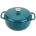 A Lodge Lagoon enameled cast iron Dutch oven in blue with a lid.