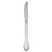 A Oneida Marquette stainless steel dinner knife with a white handle.