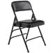 A National Public Seating black metal folding chair with black vinyl padded seat.