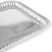 A silver rectangular fluted stainless steel tray with a design on it.