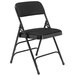 A National Public Seating black metal folding chair with a black padded seat and back.