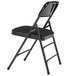 A National Public Seating black metal folding chair with a black padded seat.