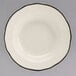 A white china bowl with a black scalloped rim.