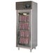 A Stagionello stainless steel meat curing cabinet with meat in it.