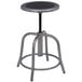 A round metal stool with a black seat and grey base.