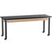 A National Public Seating height adjustable science lab table with black legs and wheels.