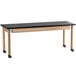 A black and wood science lab table with wheels.