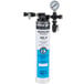 A silver Hoshizaki water filtration system with a gauge.