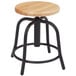 A National Public Seating black lab stool with a wooden seat.