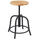 A black National Public Seating lab stool with a wooden seat and metal base.