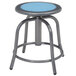 A National Public Seating lab stool with a blueberry steel seat and metal base.