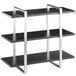 A black and silver Cal-Mil 3-shelf metal frame riser.