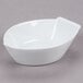 A CAC white porcelain boat bowl with a handle.