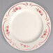 A white Homer Laughlin china plate with red flowers.