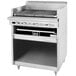 A stainless steel Garland liquid propane charbroiler with a lid open.