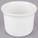 A close up of a white Tuxton Petite China Marmite Soup Crock with a lid.