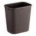 A black plastic rectangular Lavex trash can.