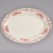 A white Homer Laughlin china platter with pink flowers on it.