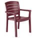 A case of 12 red Grosfillex Acadia Bordeaux stacking resin armchairs.